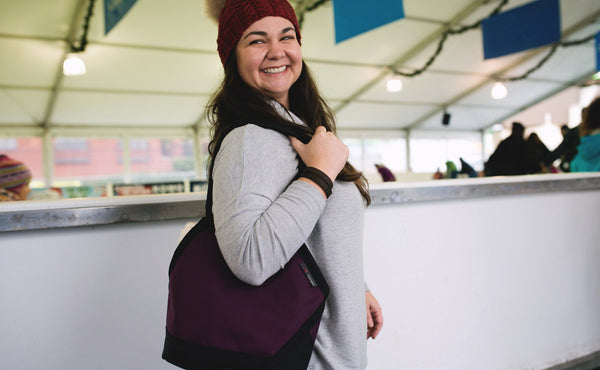 A person carrying the Little Swift over their shoulder.